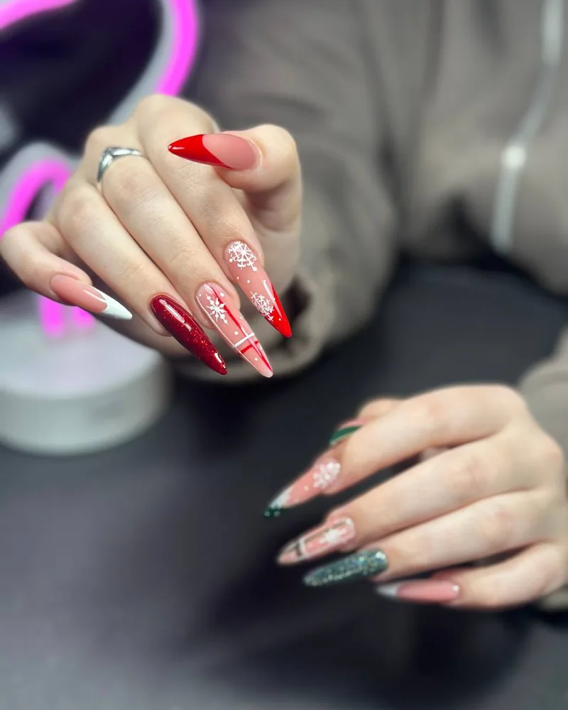 Red Christmas nail art snowflakes — nail artist Viktoriya Vilnius